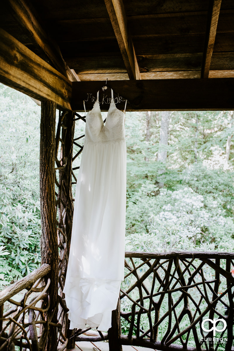 Wedding dress hanging on the porch.