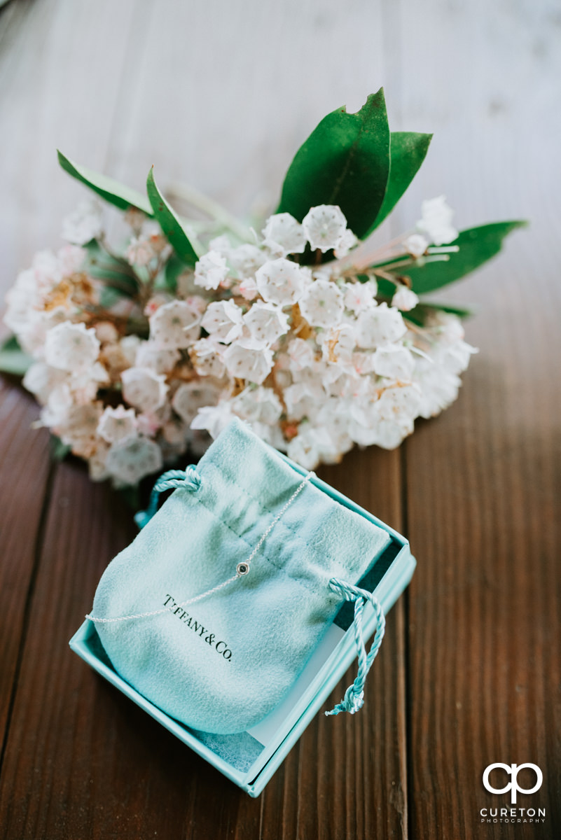 Tiffany and Co. bag and flowers.