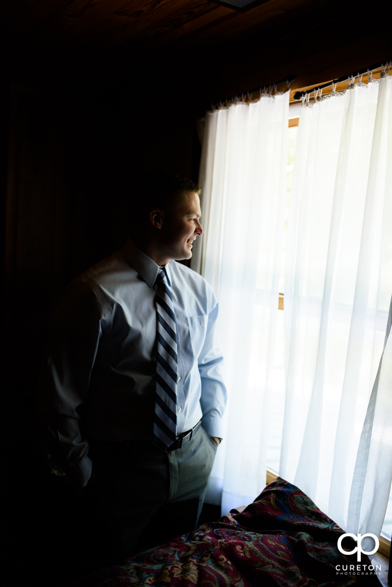 Groom looking out the window.