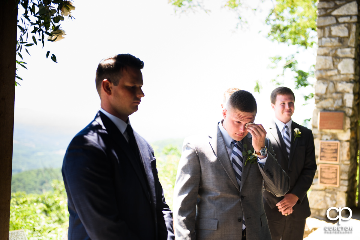 Groom getting emotional at his wedding at Symmes Chapel.