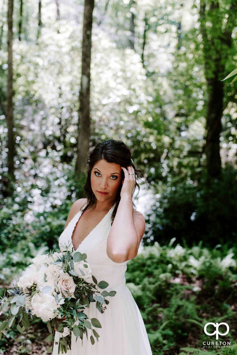 Bride in the forest after her elopement wedding outside of Greenville,SC.