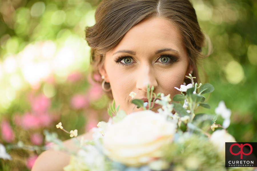 Whimsical bridal photo with vintage flowers .