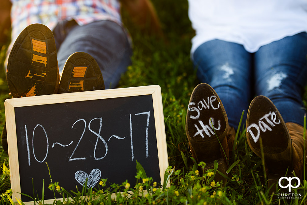 Save the Date written on boots.