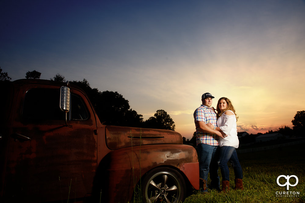 Engaged couple at sunset in a field in Travelers Rest, SC.