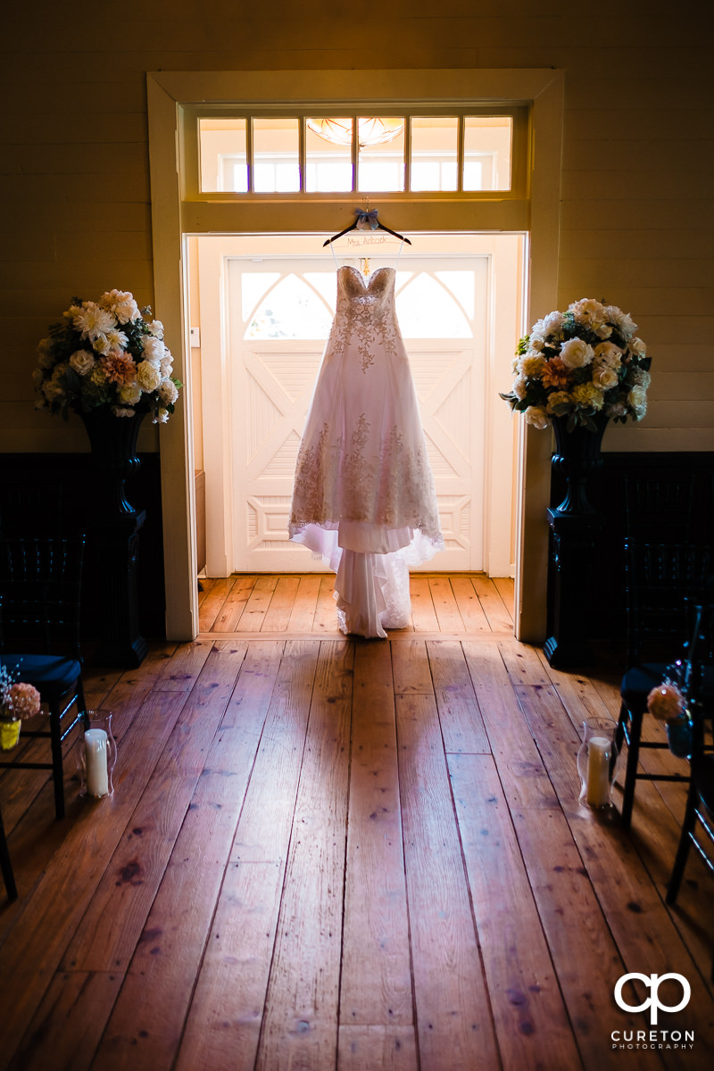 Bridal dress hanging in the Tybee Island Wedding Chapel.