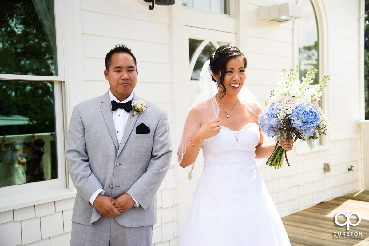 Bride and her brother outside the Tybee Island Wedding Chapel.