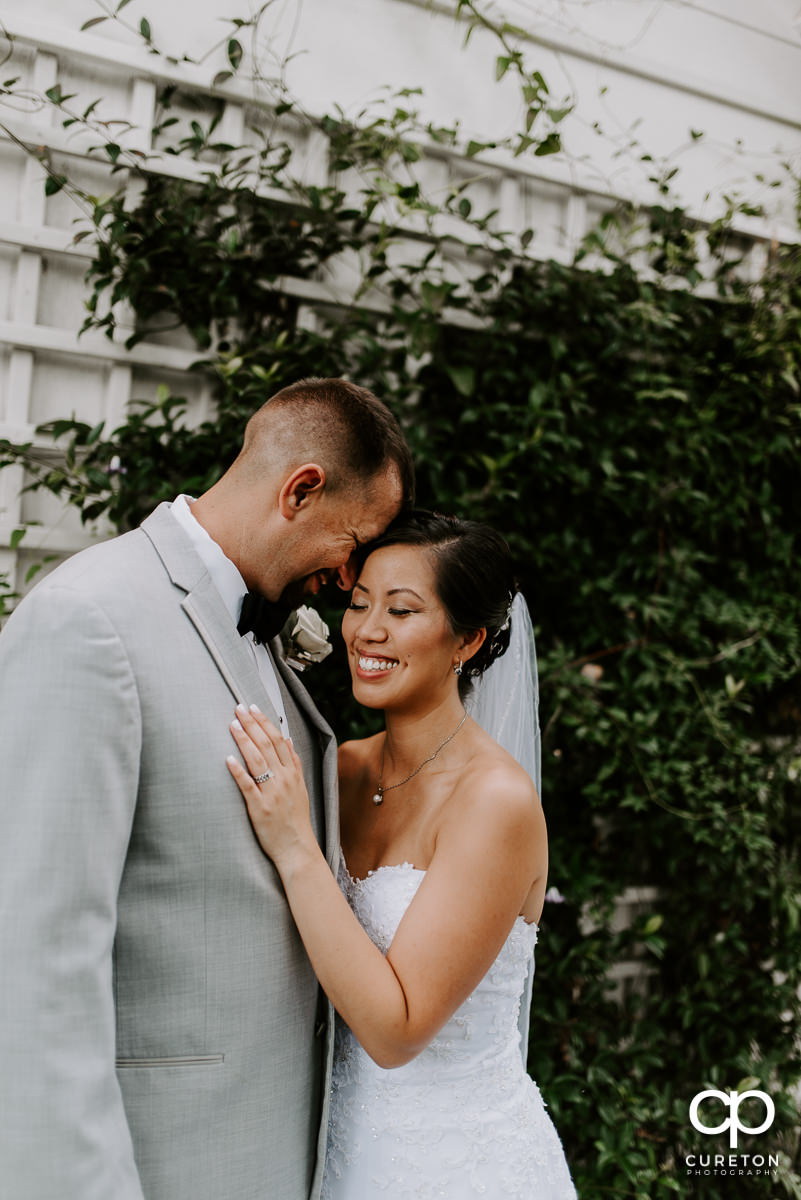 Bride and groom laughing together after their Tybee Island wedding.