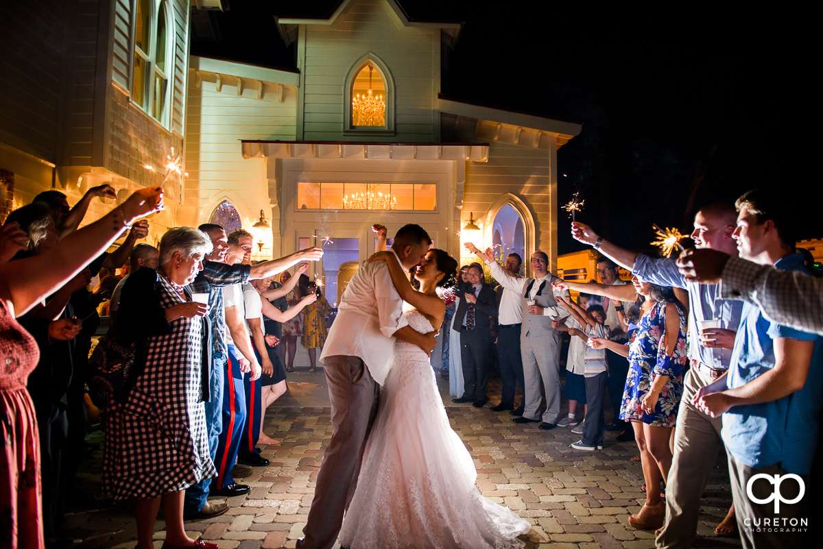 Bride and groom sparkler exit at the reception at the Tybee Island Wedding Chapel.