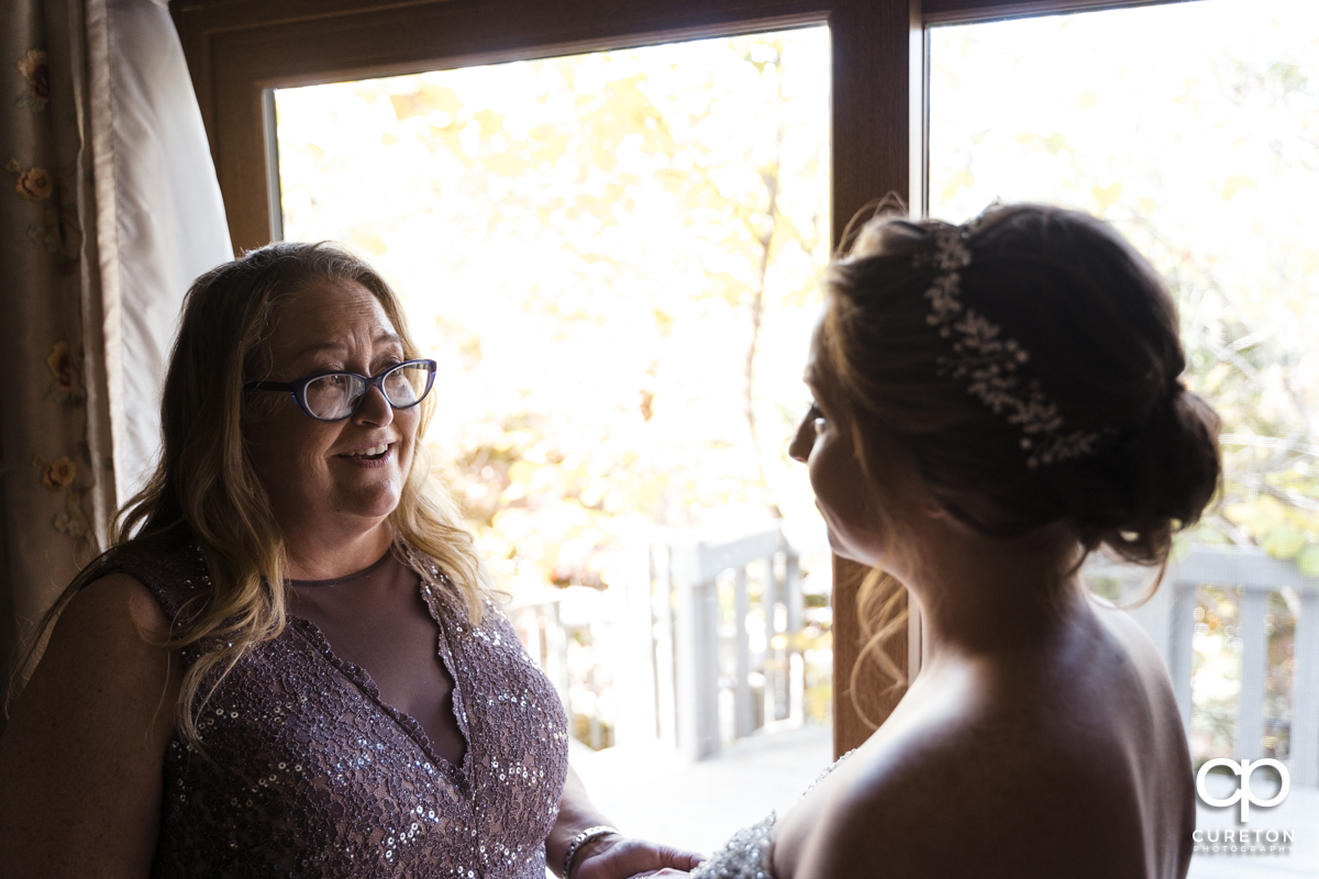 Bride and her mom having a moment before the wedding.