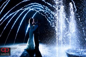 Married couple in the fountain after their wedding at the commerce club.