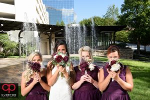 Bridesmaids and their flowers.
