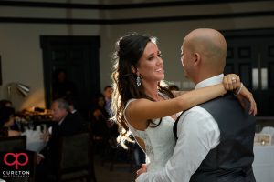Bride smiling at her groom during their first dance.