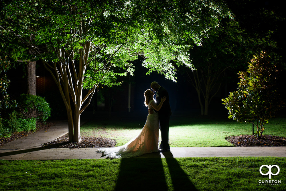 Bride and groom at sunset after their wedding at The Loom at Cotton Mill Place in Simpsonville,SC.