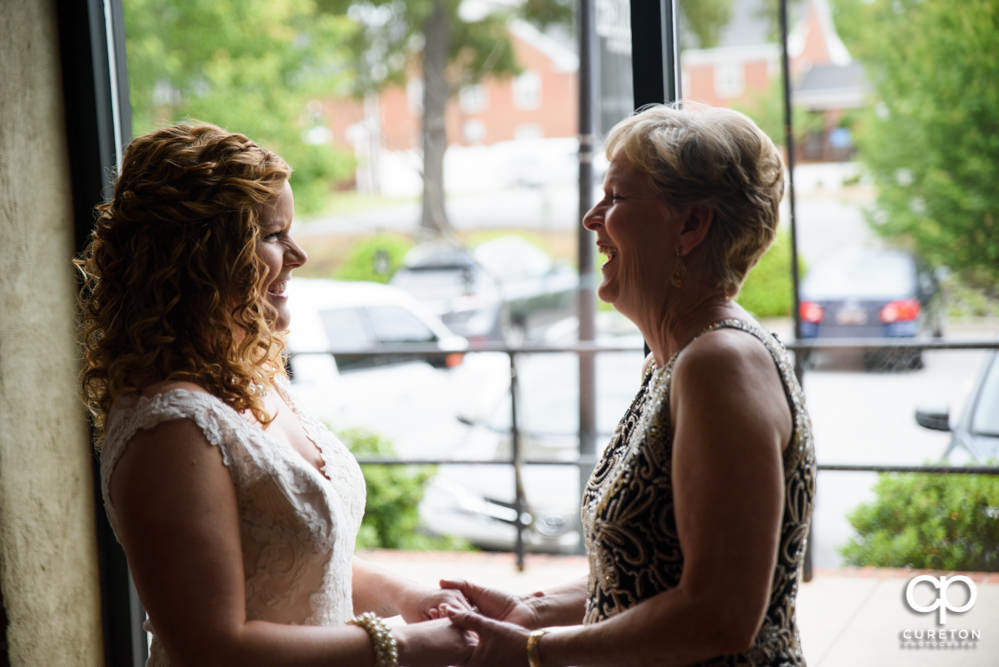 Bride and her mom having a moment before the wedding.