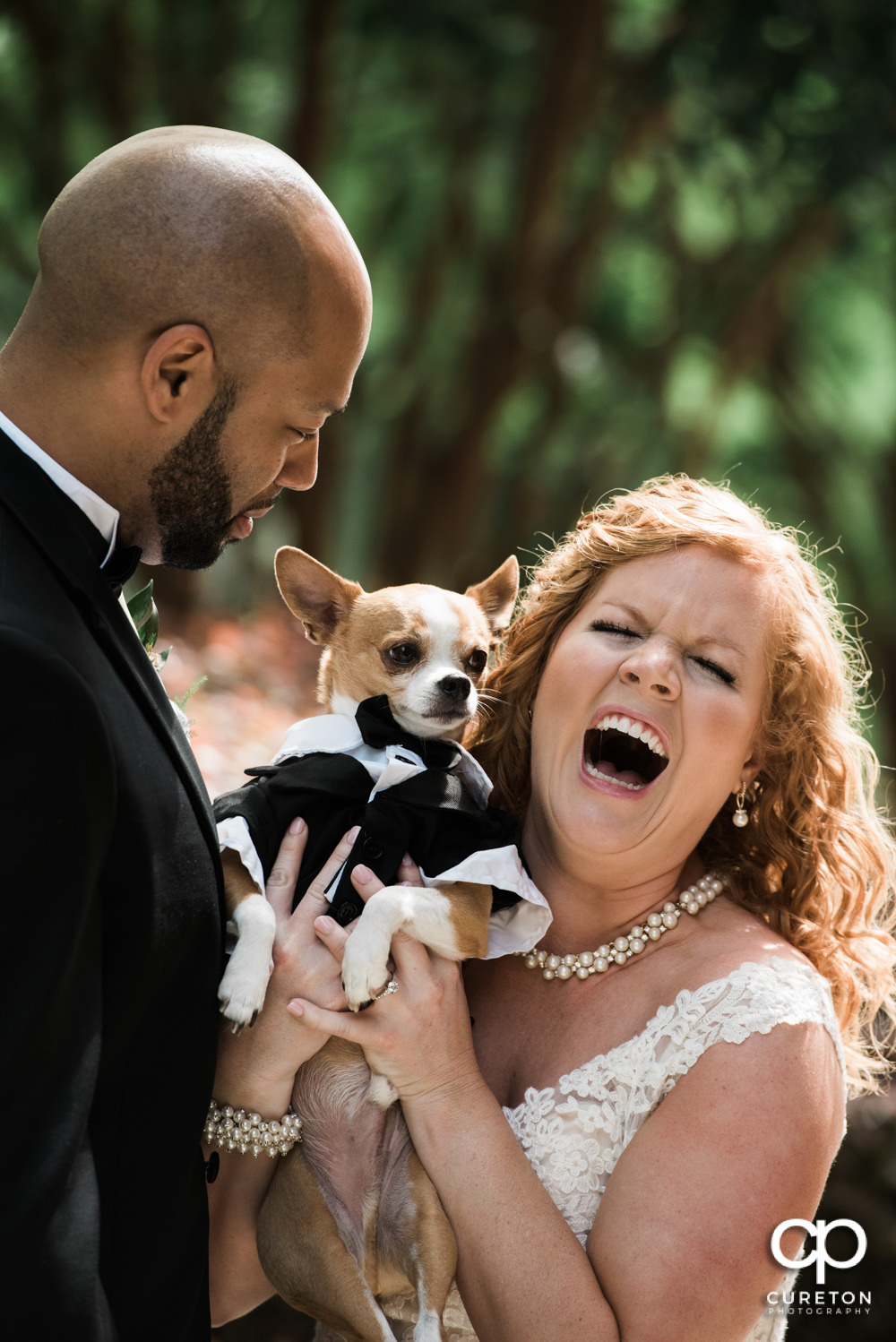 Bride and Groom with their dog before the wedding.