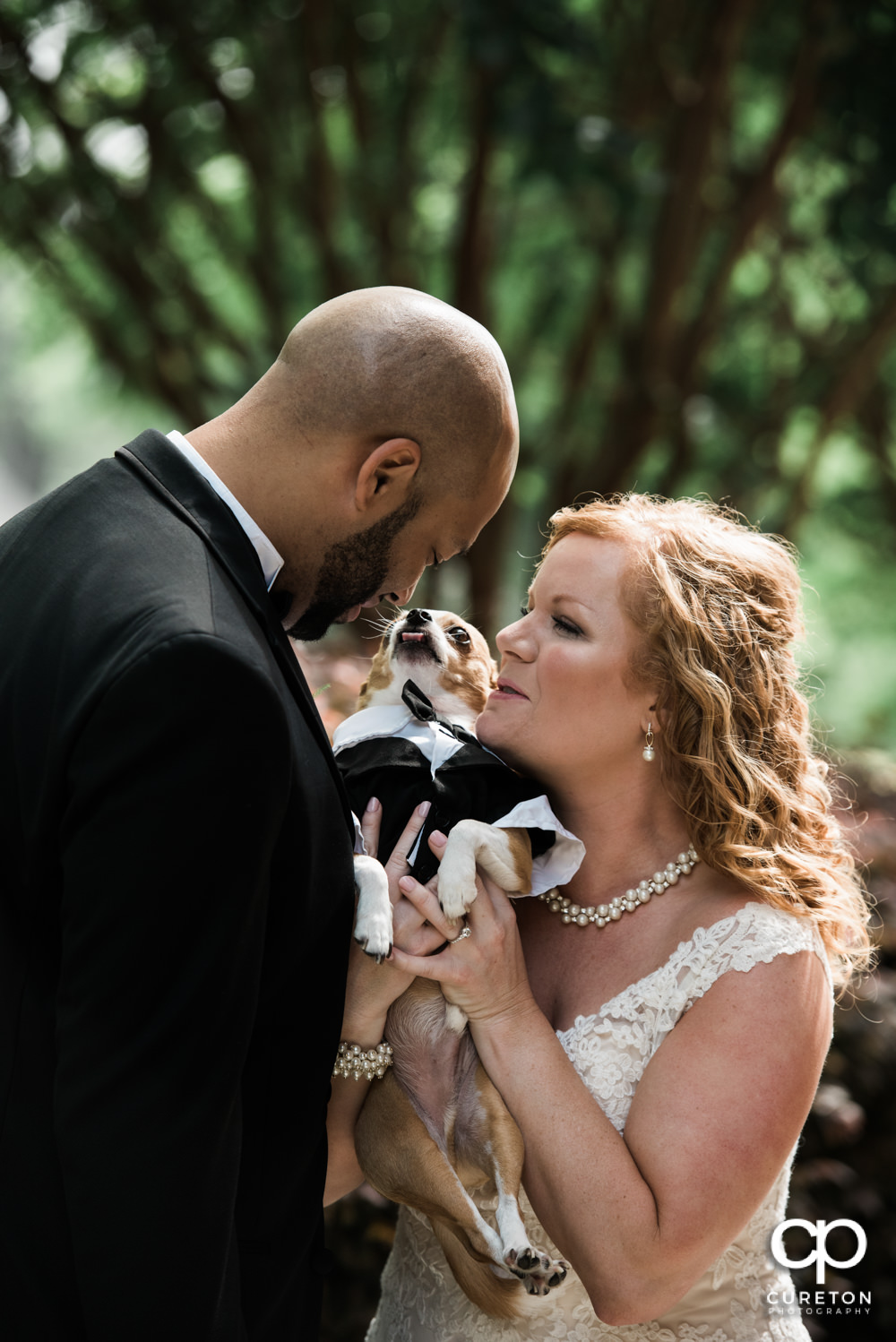 Bride and Groom with their dog before the wedding.