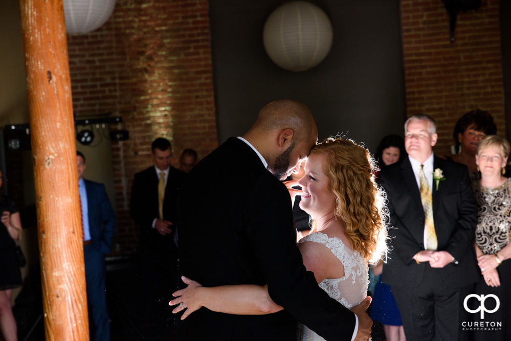 Bride and groom sharing their first dance at the wedding reception at The Loom.