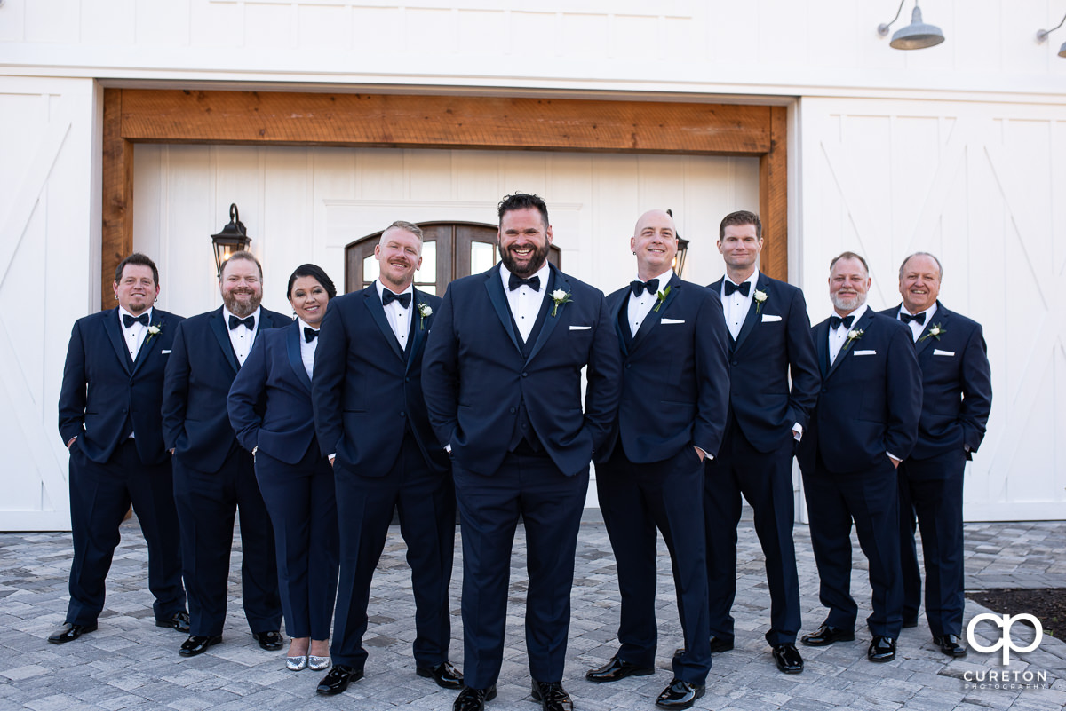 Groom and groomsmen in a v formation.