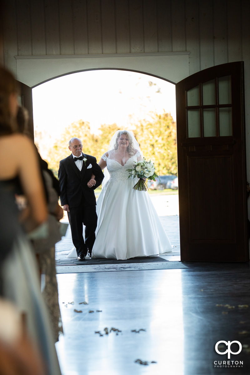 Bride and her dad making an entrance.