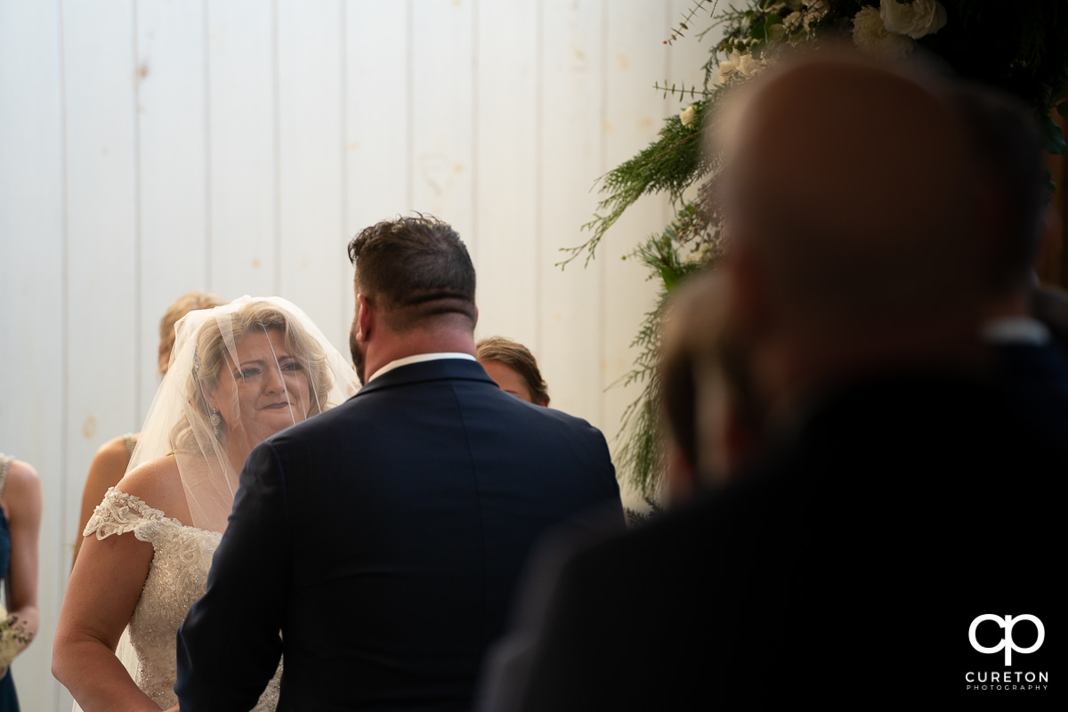 Bride crying during her vows.