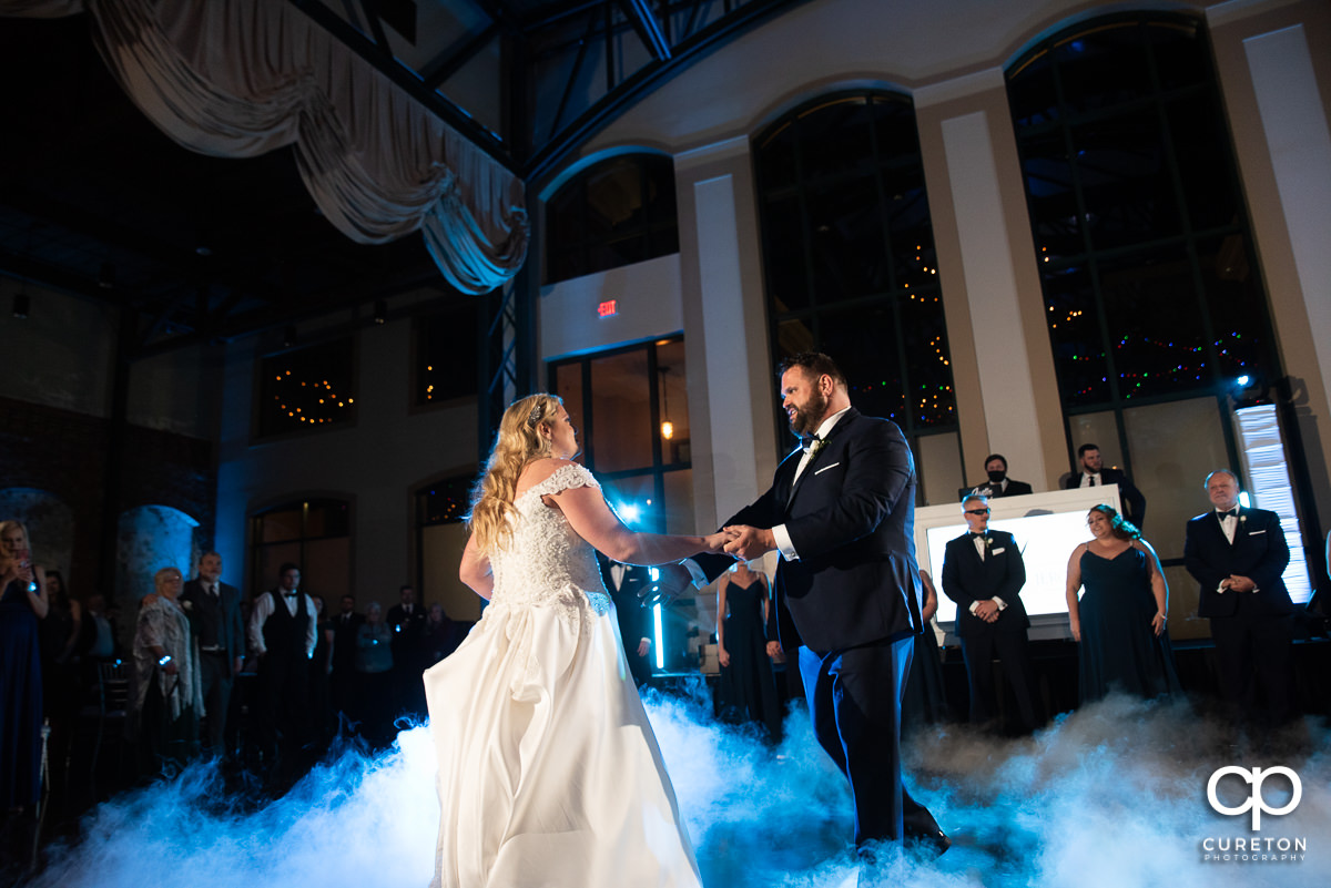 Bride and groom dancing on a cloud.