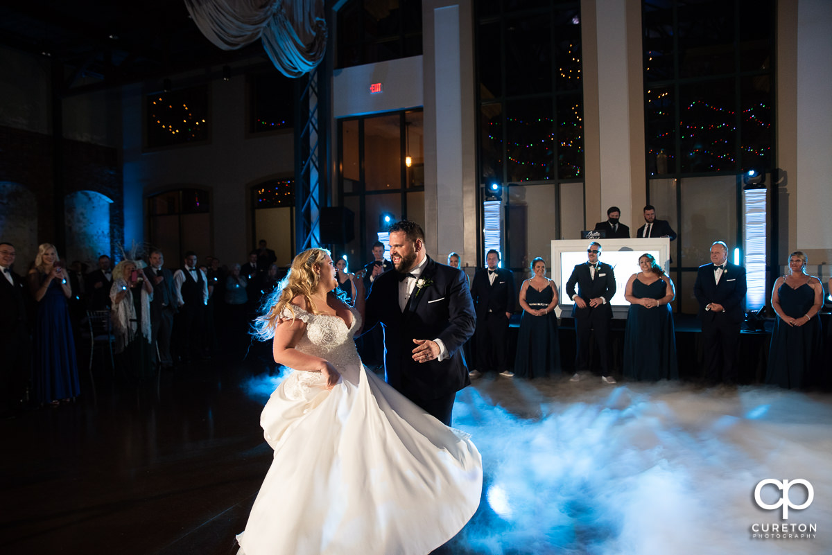 Bride and groom dancing on a cloud.