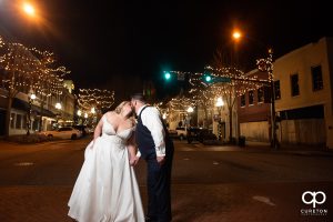 Bride and groom crossing the street in downtown Anderson,SC.