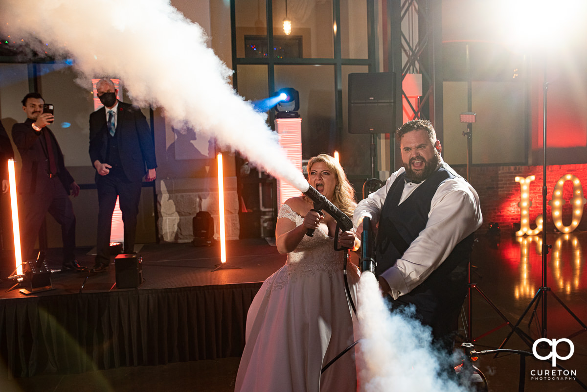 Bride and groom using club cannons.