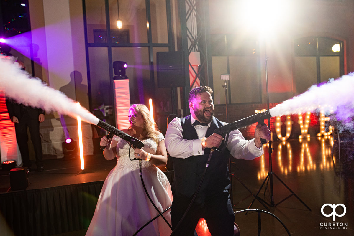 Bride and groom using club cannons.