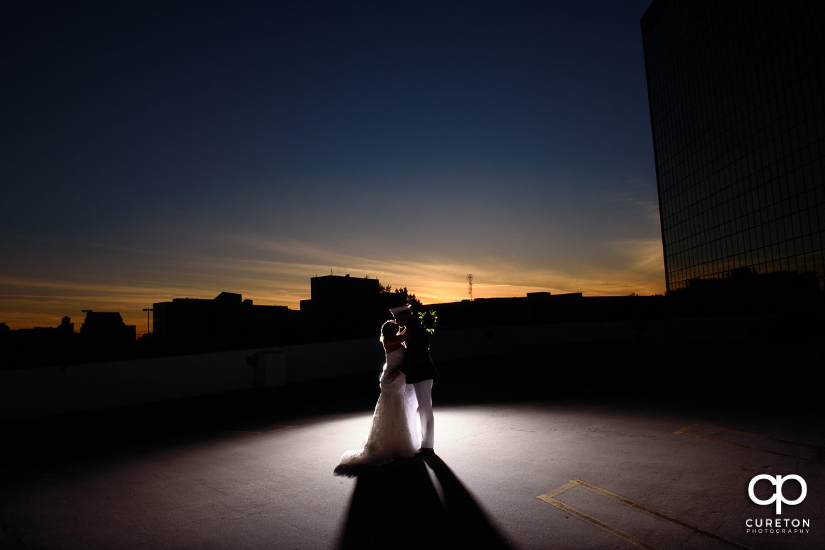 Bride and groom at sunset on a rooftop after their wedding ceremony at The Commerce Club in Greenville,SC.