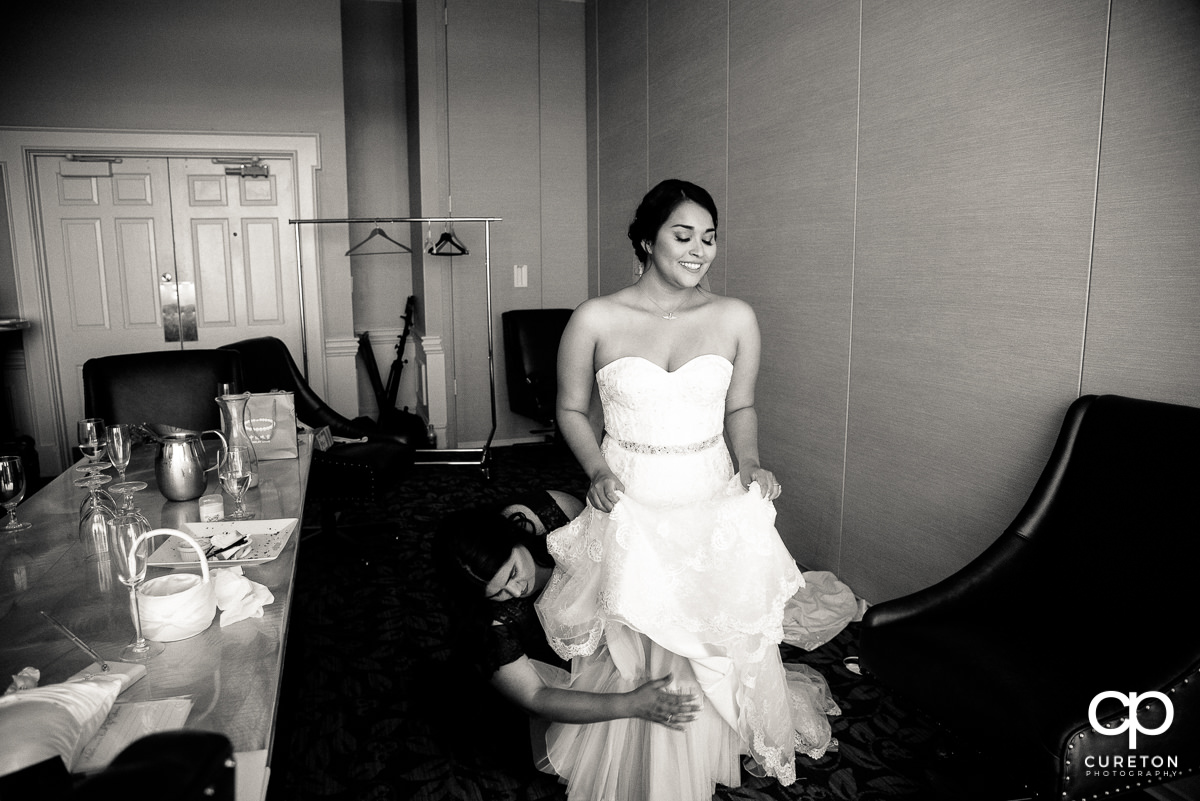 Bride getting dressed.