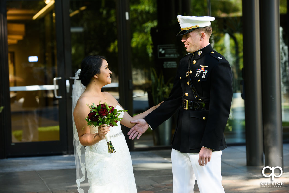 Bride and military groom first look.