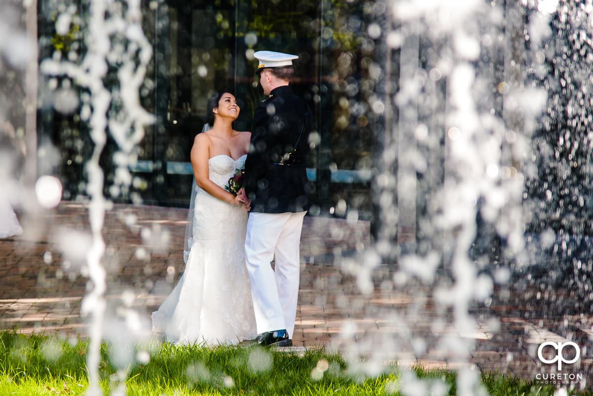 Bride and Groom first look though the fountain.