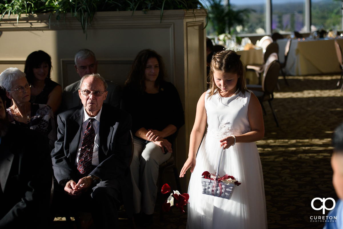 Flower girl walking down the aisle.