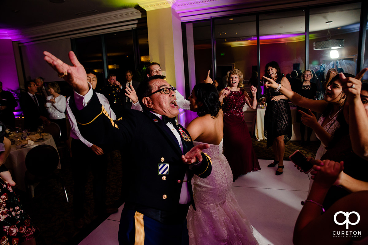 Bride's family on a packed dance floor at the Commerce Club wedding reception.