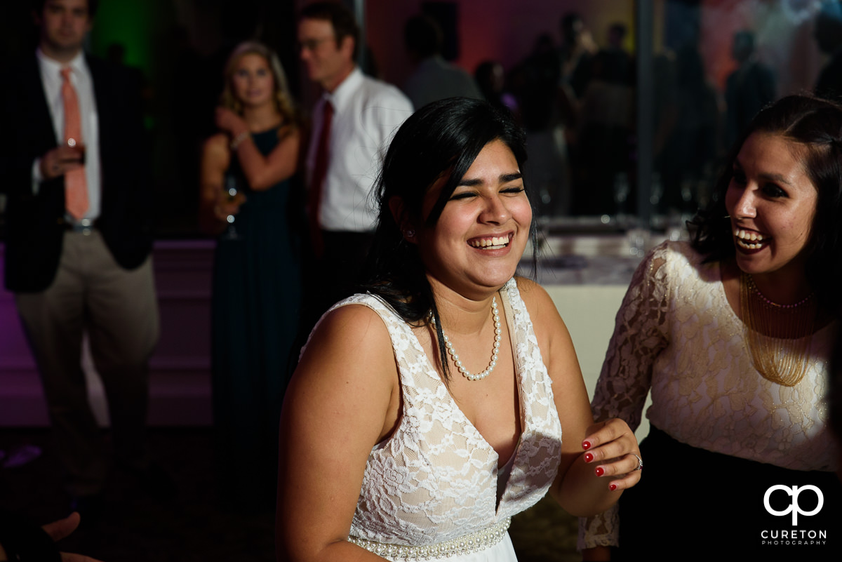 Bride's sister dancing.