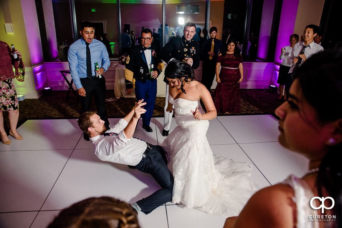 Bride dancing with a wedding guest.