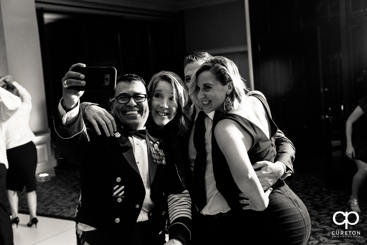 Reception guests taking a selfie.