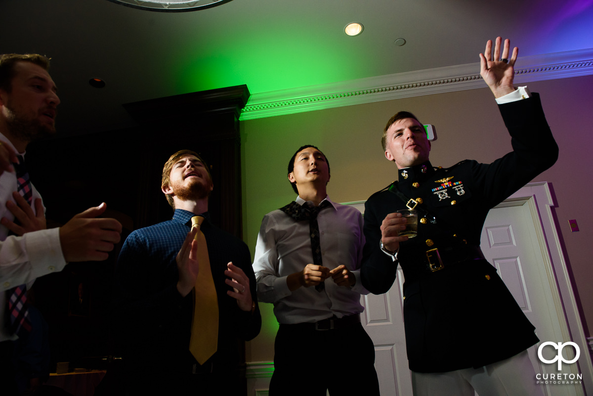 Groom singing at his reception.