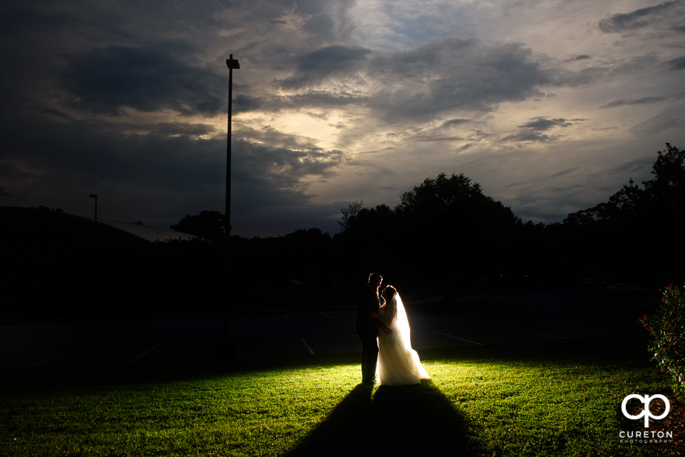 Bride and groom silhouette at sunset after their Loom wedding.
