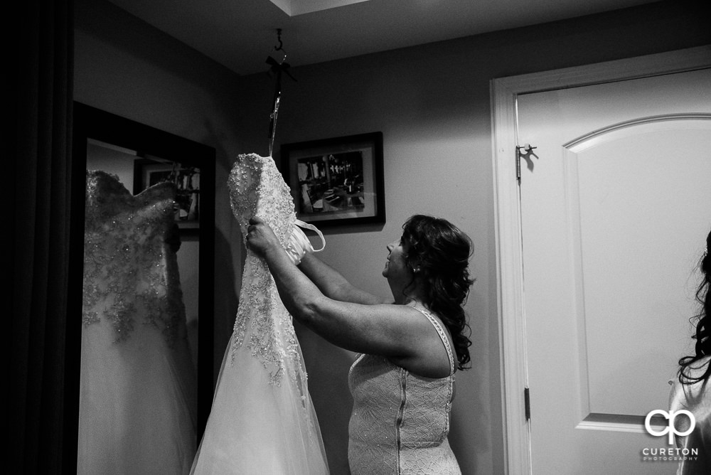 Bride's mom looking at her dress.