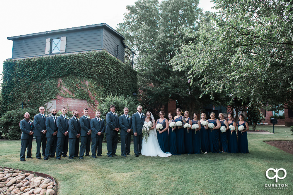 The entire wedding party out back of the Loom at Cotton Mill Place.