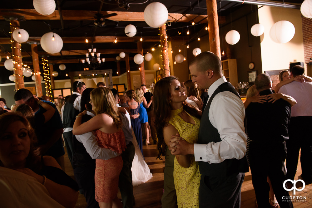 Wedding guests dance at the reception to the sounds of DJ EZ.