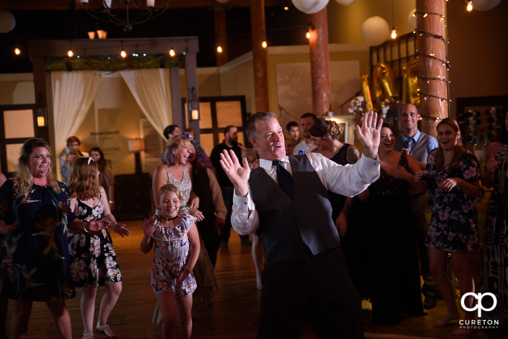 Wedding guests dance at the reception to the sounds of DJ EZ.