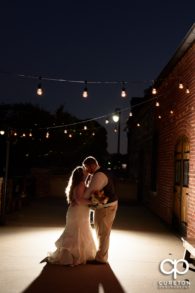Bride and groom on the deck of The Old Cigar Warehouse in Greenville,SC.