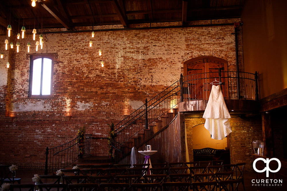 Bride's dress hanging in The Old Cigar Warehouse.