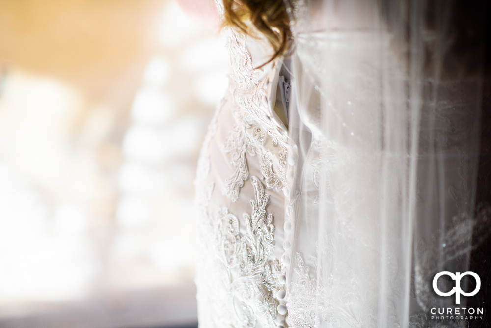 Bride getting into her dress.