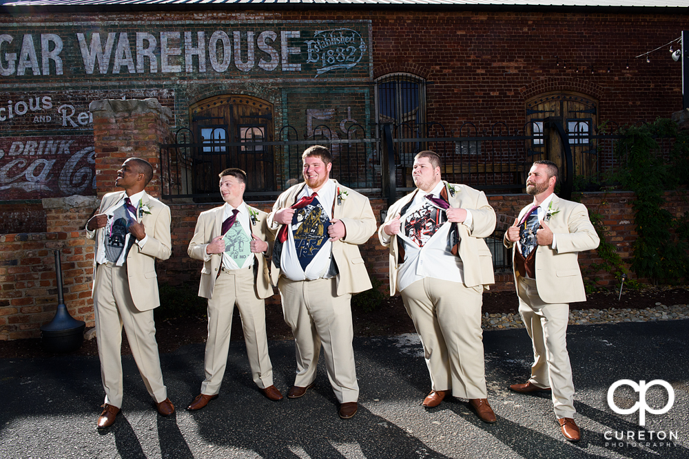 Groomsmen showing off their Star Wars undershirts.