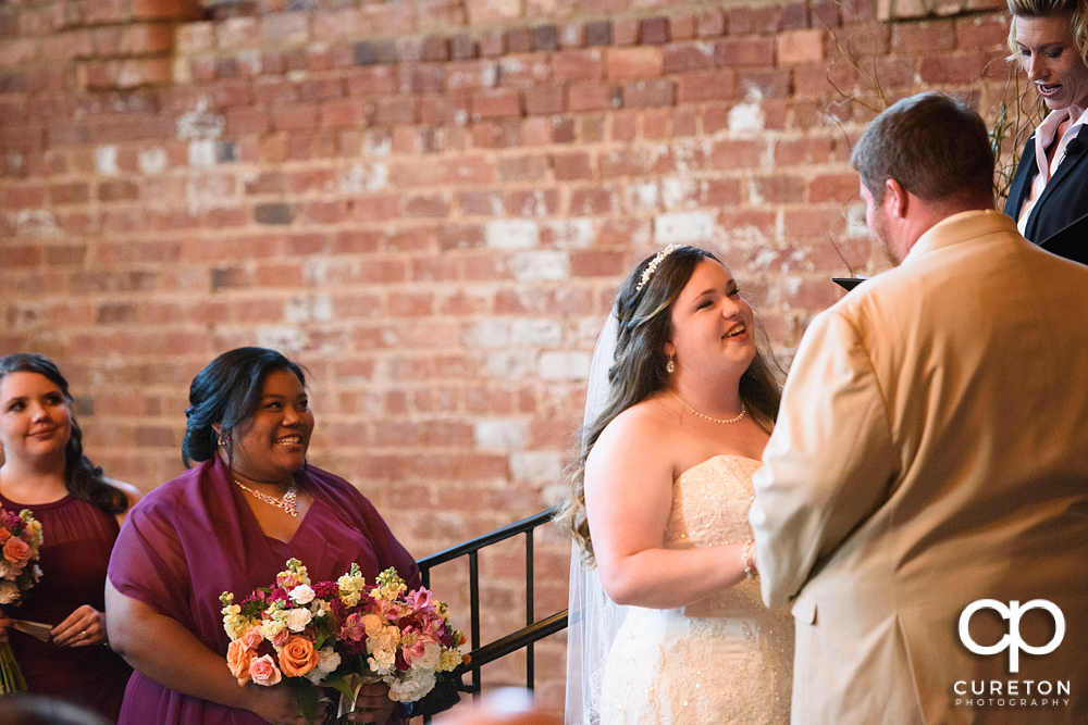 Bride smiling at her groom.