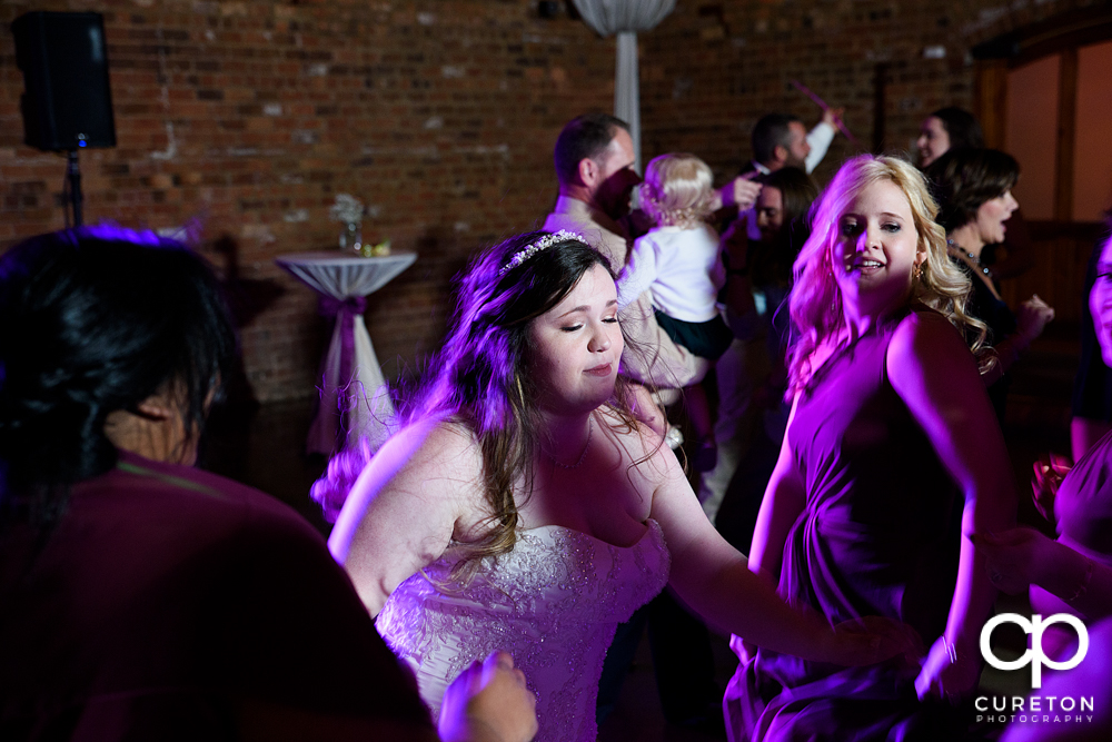 Wedding guests dancing to the sounds of Uptown Entertainment.